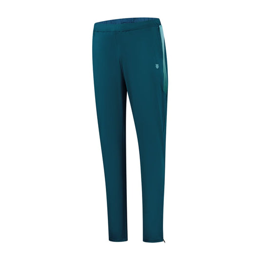 The K-Swiss Tac Hypercourt Tennis Tracksuit Pants 5 in Blue Opal boast an elastic waistband, a small logo on the side, and a slim fit design. These tracksuit pants from the K-Swiss brand feature side stripes and subtle stitching detail along the legs.