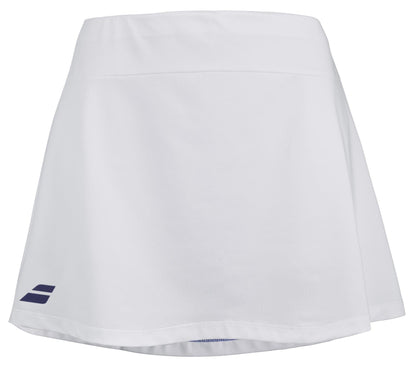 The Babolat Play Women's Tennis Skirt in white, designed by Babolat and featuring Fiber Dry technology, includes a subtle logo near the bottom hem on the left side. This sporty skirt is made of lightweight fabric for optimal comfort and 360 Motion on the court.
