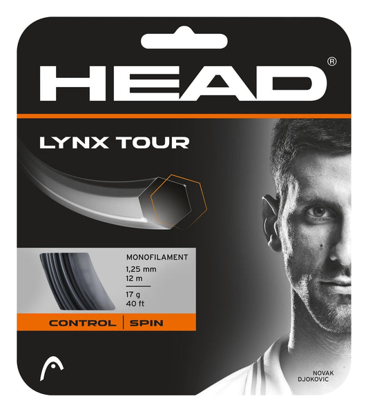 The HEAD Lynx Tour Tennis String Set - Black by HEAD features a stylish packaging in black and orange, prominently displaying its specifications of 1.25 mm gauge over 12 m (40 ft) of premium monofilament designed for superior control and spin. An eye-catching image, focusing on half of a person's face, underscores the product's precision and style.