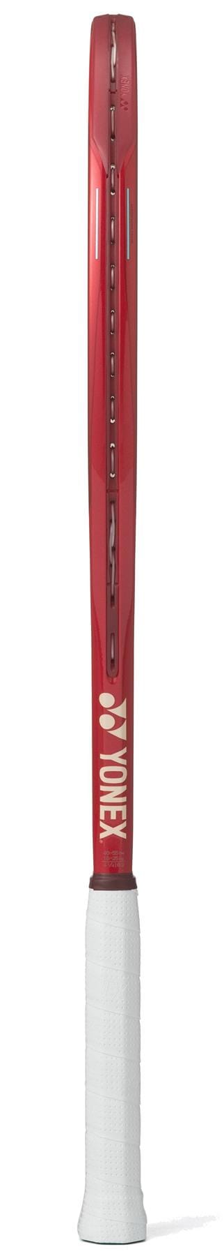 The Yonex VCORE 100L Ruby Red 2026 Tennis Racket features a white grip and Yonex branding near the base, with a side profile designed to boost spin potential on court.