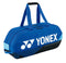 The Yonex 92431WEX Pro Tournament 6 Racket Tennis Bag in cobalt blue is ideal for professional tournament use, featuring black and light blue accents. It comes with dual handles, a logo on the side, and two zippered compartments perfect for storing rackets and other sports equipment.