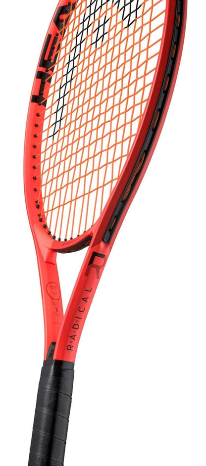 A close-up of the HEAD Radical Junior 25 2025 Tennis Racket, showing "RADICAL" on the side, a black grip handle, and orange strings. This HEAD junior tennis racket is angled diagonally against a white background.