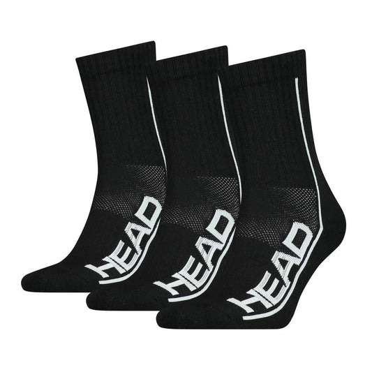 A set of three HEAD Performance Tennis Socks (3 Pack) in black with "HEAD" written in white along the sides, equipped with cushioned soles for shock absorption, are arranged in a row against a white background.