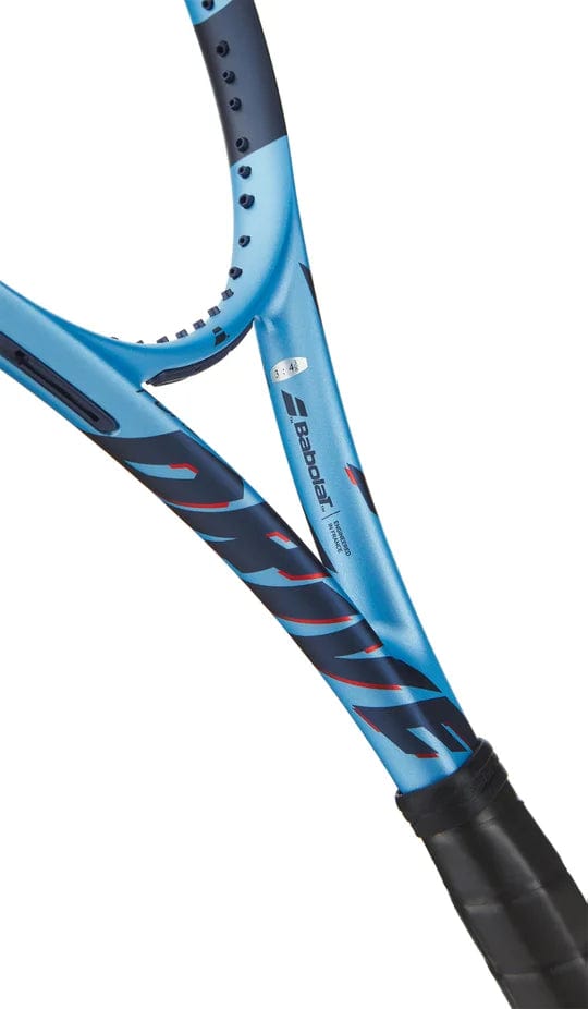 Close-up of a Babolat Pure Drive 2025 Tennis Racket frame shows part of the throat and grip, with visible strings, Babolat branding, and FSI Power technology details.
