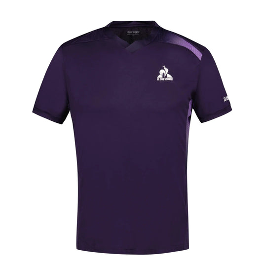 The Le Coq Sportif Pro Men's Tennis T-Shirt in Deep Purple is crafted from breathable polyester with a V-neck design. It boasts a small rooster logo on the left chest and the Le Coq Sportif brand name on the left sleeve. With its short sleeves and slim fit, it provides optimal fluidity in movement, making it perfect for tennis.