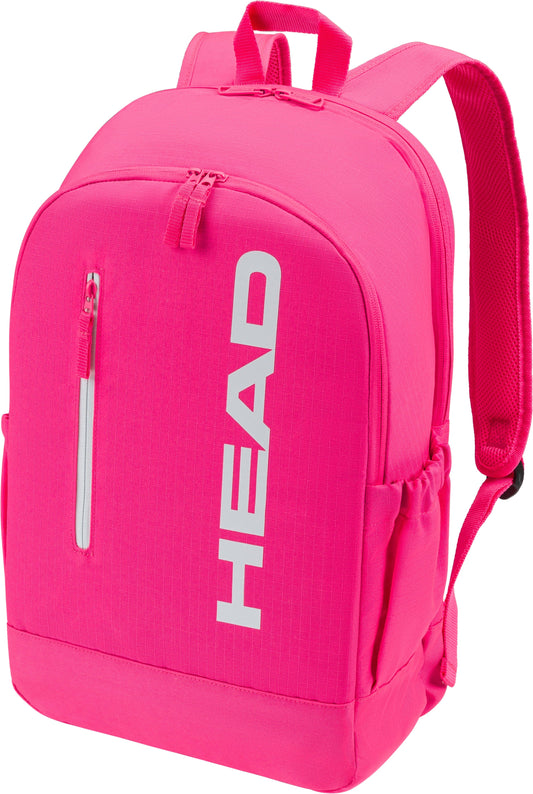 The HEAD Base 17L Tennis Backpack in bright pink features a front zipper pocket, side pockets, and adjustable shoulder straps. “HEAD” is printed vertically in large white letters—ideal for carrying your tennis gear.