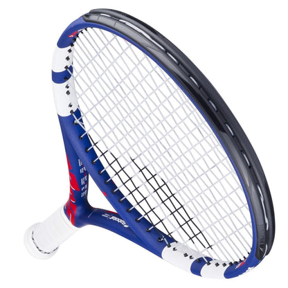 The Babolat Drive Junior 25 Tennis Racket by Babolat features a blue, white, and red frame with white strings and a white grip—ideal as a kids’ tennis racket. Shown angled against a white background.
