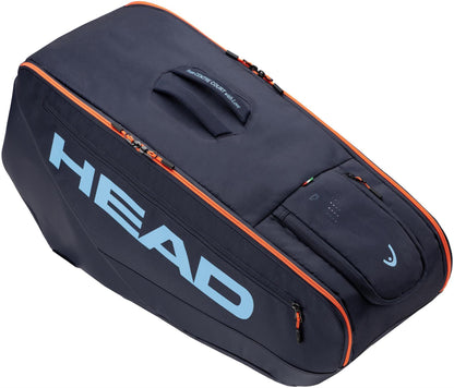 The HEAD Pro 9 Racket Tennis Bag L – Navy features a spacious design, top handle, multiple compartments, and a bold navy color with a blue HEAD logo—ideal for tennis enthusiasts and inspired by Jannik Sinner.