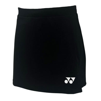 The Yonex YSKT2024 Women's Tennis Skirt/Skort in black, made from lightweight breathable materials, features the brand's iconic small white logo with circular and triangular shapes on the lower left side.