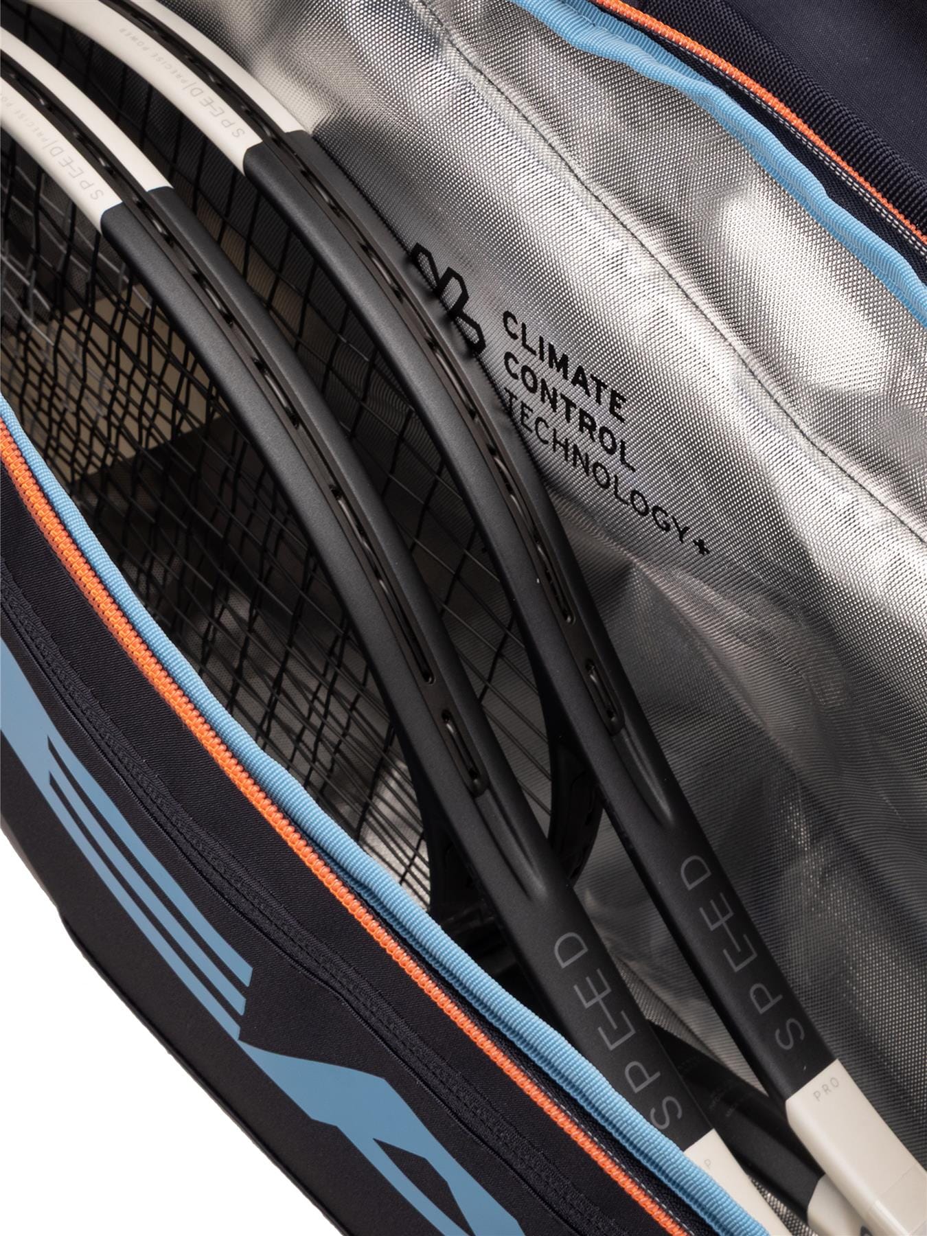 Close-up of the HEAD Pro 9 Racket Tennis Bag L - Navy by HEAD, as used by Jannik Sinner, featuring orange and blue trim, a silver CLIMATE CONTROL TECHNOLOGY+ lining, and room for multiple SPEED rackets.