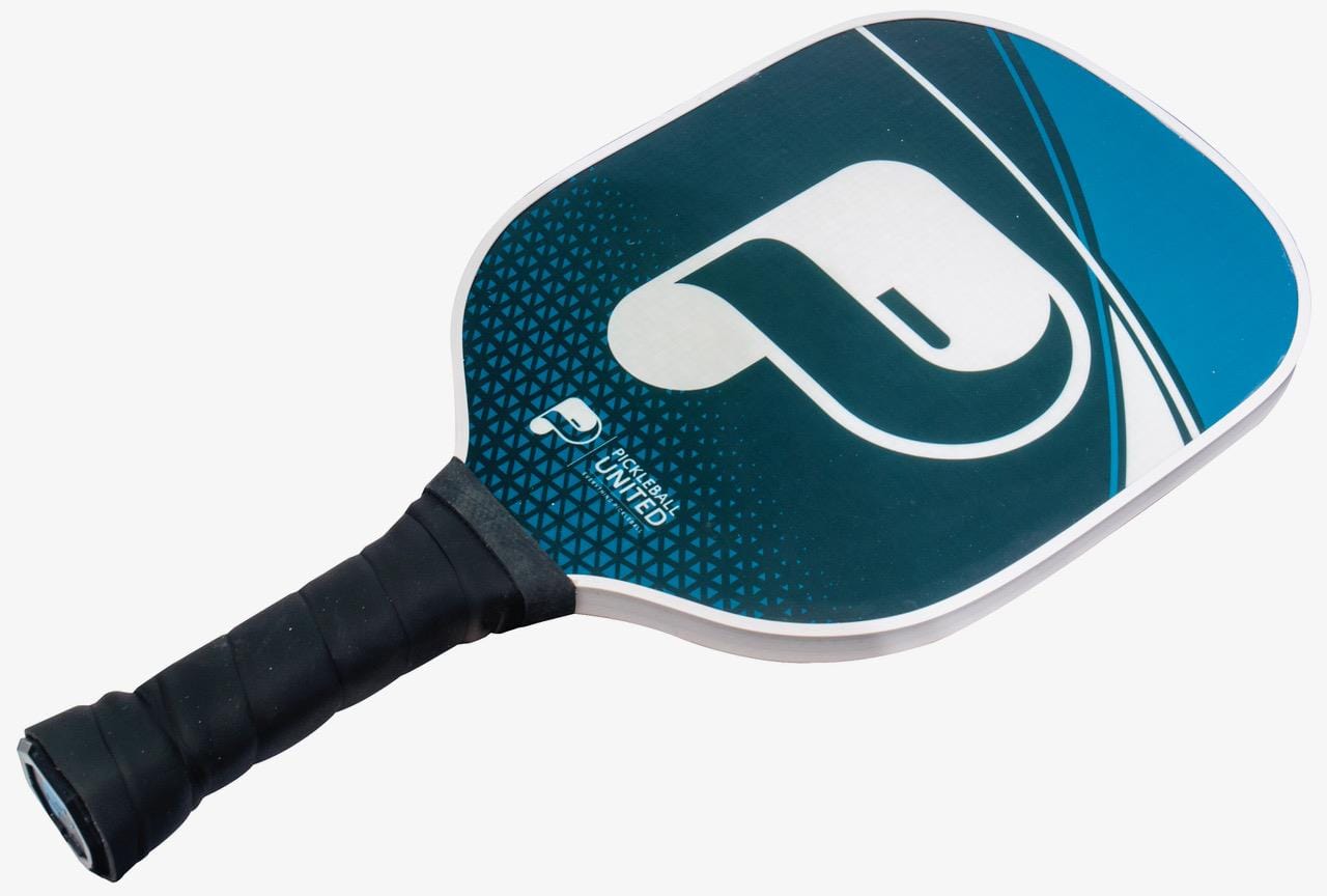 The Pickleball United Freedom Paddle features a blue and white geometric design, stylized "P" logo, black grip, fiberglass surface, and a polypropylene honeycomb core for enhanced performance.