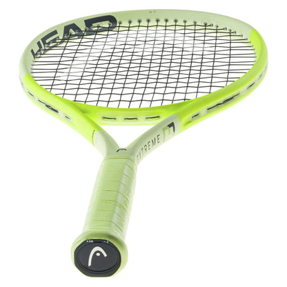 The HEAD Extreme MP 2024 Tennis Racket in a vibrant green color showcases a black mesh pattern with the word "HEAD" prominently displayed on the frame. Its grip is wrapped in matching green material and features "EXTREME" along the handle. This racket utilizes innovative HEAD Auxetic 2.0 technology to deliver exceptional spin.