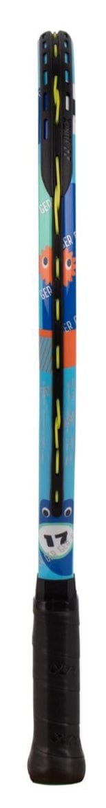A close-up of the Yonex Junior 17 Ocean Blue Tennis Racket shows playful cartoon faces on the shaft, a black grip at the bottom, and yellow string in the head.