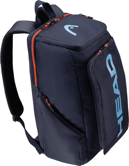 The HEAD Pro 28L Tennis Backpack in navy features orange zipper accents, padded shoulder straps, multiple compartments including a racket compartment, and the HEAD logo in light blue on the front pocket.