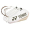 The Yonex 92429EX 9 Racket Pro Tennis Bag in Sand Beige features brown straps and prominently displays the Yonex logo along with the "Pro Performance" text. This bag is equipped with multiple zippered compartments and specialized racket sections featuring Thermo Guard technology to ensure optimal protection for your badminton gear.