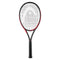 The HEAD IG Challenge MP Tennis Racket - Red, designed by HEAD, is displayed against a white background. This racket features a patterned string face and its frame is crafted with Graphite Composition to present a sleek design. Enhanced performance is achieved through the incorporation of Innegra™ technology, and it comes with a black grip handle.