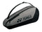 The Yonex 42523EX Team 3 Racket Tennis Bag in grey/black is lightweight and compact, featuring smooth YKK zippers and a prominent Yonex logo. Designed for convenience, it includes a shoulder strap for easy carrying.