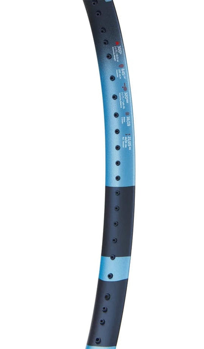 Close-up of the blue and black Babolat Pure Drive 2025 Tennis Racket frame, showing string holes and specs, and highlighting its advanced FSI Power technology.