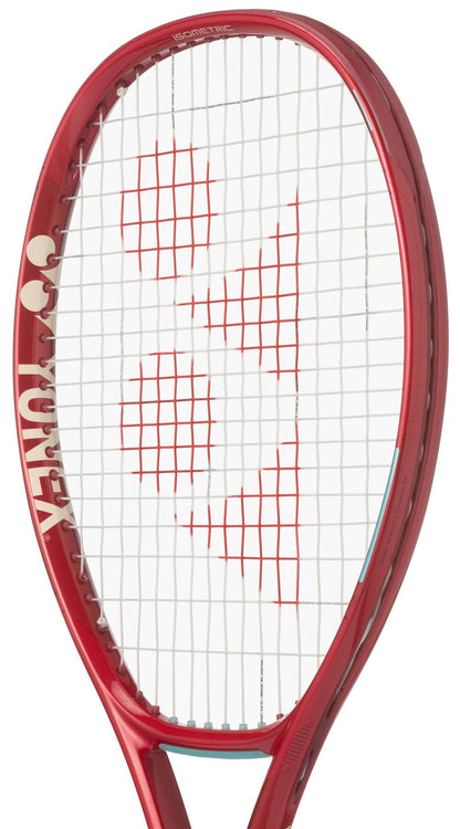 A close-up of the Yonex VCORE 100L Ruby Red 2026 Tennis Racket displays its white strings with red logo markings and part of the frame, crafted by Yonex for outstanding spin potential.