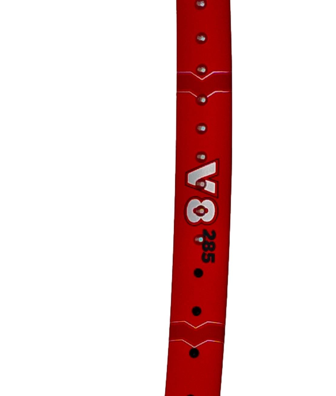 A red wristband with silver dots, ideal for pairing with your Volkl Vostra V8 285g Tennis Racket and boosting your performance on the court.