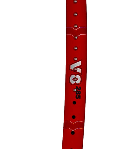 A red wristband with silver dots, ideal for pairing with your Volkl Vostra V8 285g Tennis Racket and boosting your performance on the court.