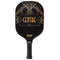 The Franklin Center Signature Pickleball Paddle by Franklin features MaxGrit technology, a black handle with textured grip for control, and a gold and white Art Deco geometric design with “CENTRE” boldly displayed.
