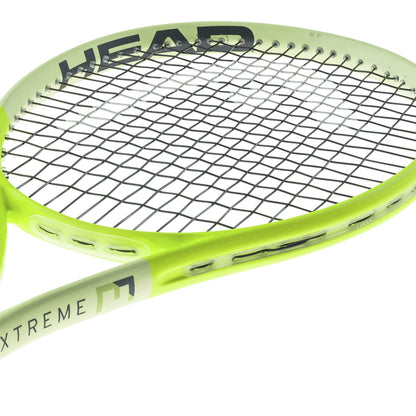 The HEAD Extreme MP 2024 Tennis Racket in green, featuring black strings, displays a modern and sleek design. It prominently features the "HEAD" logo on the rim and "EXTREME" along the side, utilizing HEAD Auxetic 2.0 technology for outstanding spin control.
