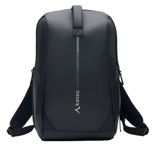 The Kanso Intuko Tennis 23L Backpack in black, perfect for everyday use, showcases a vertical zipper and "kanso" printed near the bottom. It features padded shoulder straps, a top handle, and an extra compartment for organized storage against a plain white backdrop.