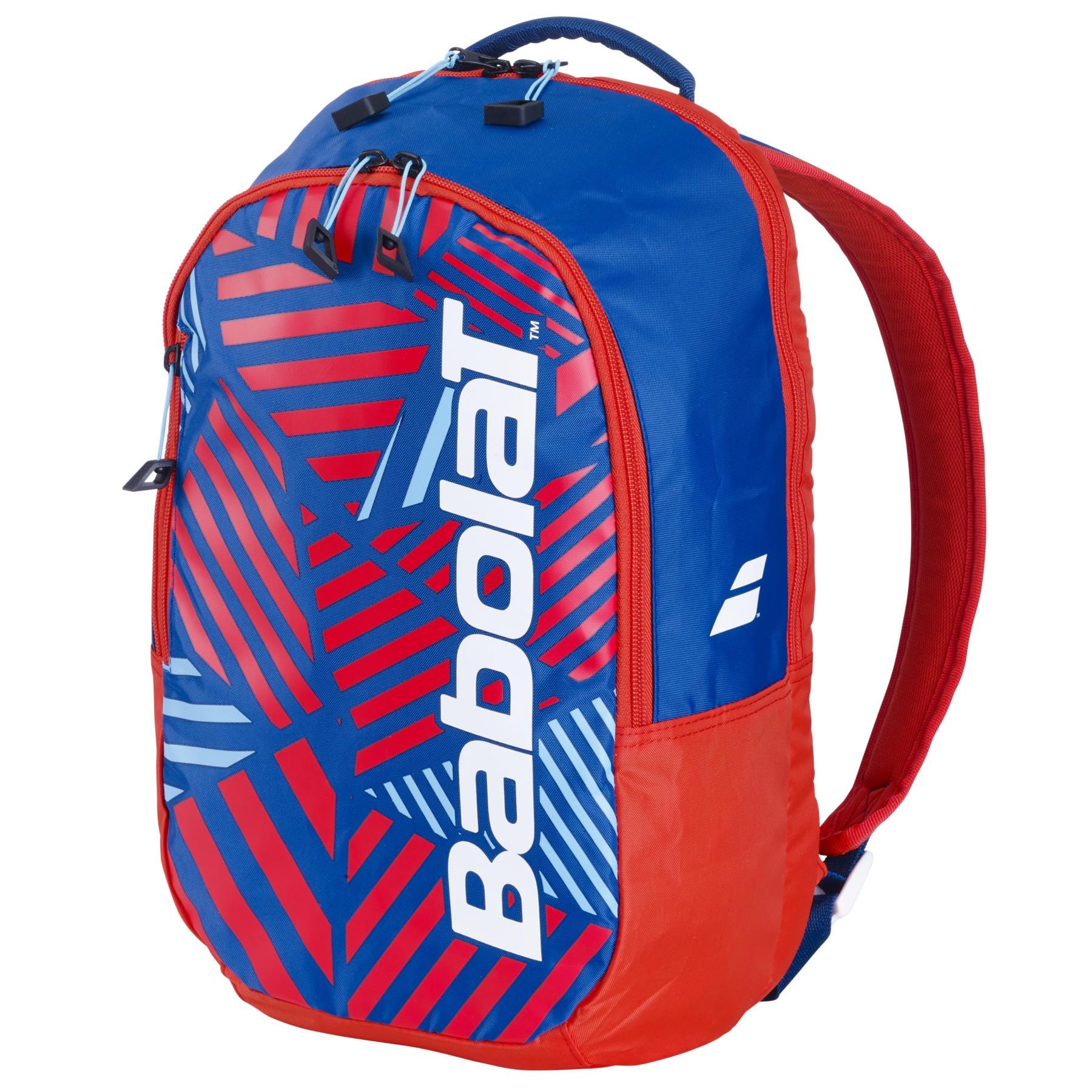 The Babolat Kids Tennis Backpack in blue and red features a geometric pattern with the brand name in large white letters. Designed for young athletes, it has a top handle, two shoulder straps, and a zippered compartment.