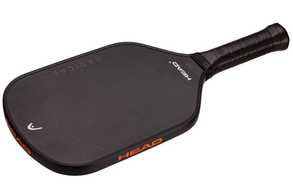The HEAD Radical Nite Pickleball Paddle is a black paddle with a wrapped handle, subtle HEAD branding, "RADICAL" text on the face and edge, and advanced SpinFusion technology for superior spin control.