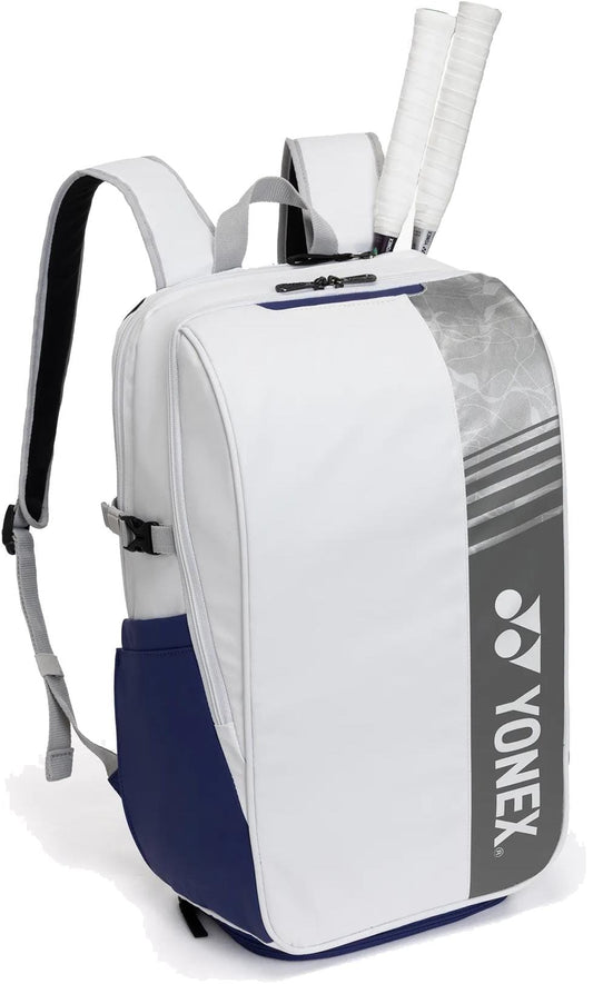 The Yonex BA52512EX Club Tennis Backpack in White/Blue features adjustable shoulder straps, a Yonex logo, and space for two racket handles—combining durability and style for every tennis match.