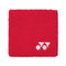 Presenting the Yonex AC493 Wristband in red, this accessory boasts a textured surface and a subtle white logo featuring two circles and a triangle in the bottom right corner, making it ideal for court activities.