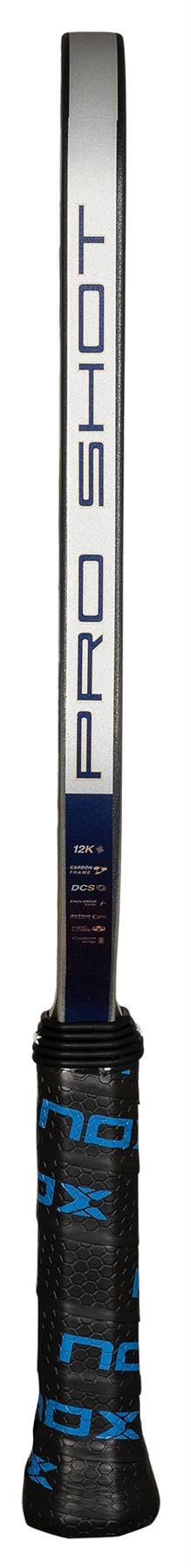 A close-up of the NOX Pro Shot Pickleball Paddle shows "PRO SHOT" printed vertically on the carbon fiber frame and a black grip wrapped around the handle.