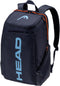 The HEAD Pro 28L Tennis Backpack - Navy features orange zipper accents, a top handle, adjustable straps, "HEAD" in light blue on the front pocket, and a convenient shoe compartment.