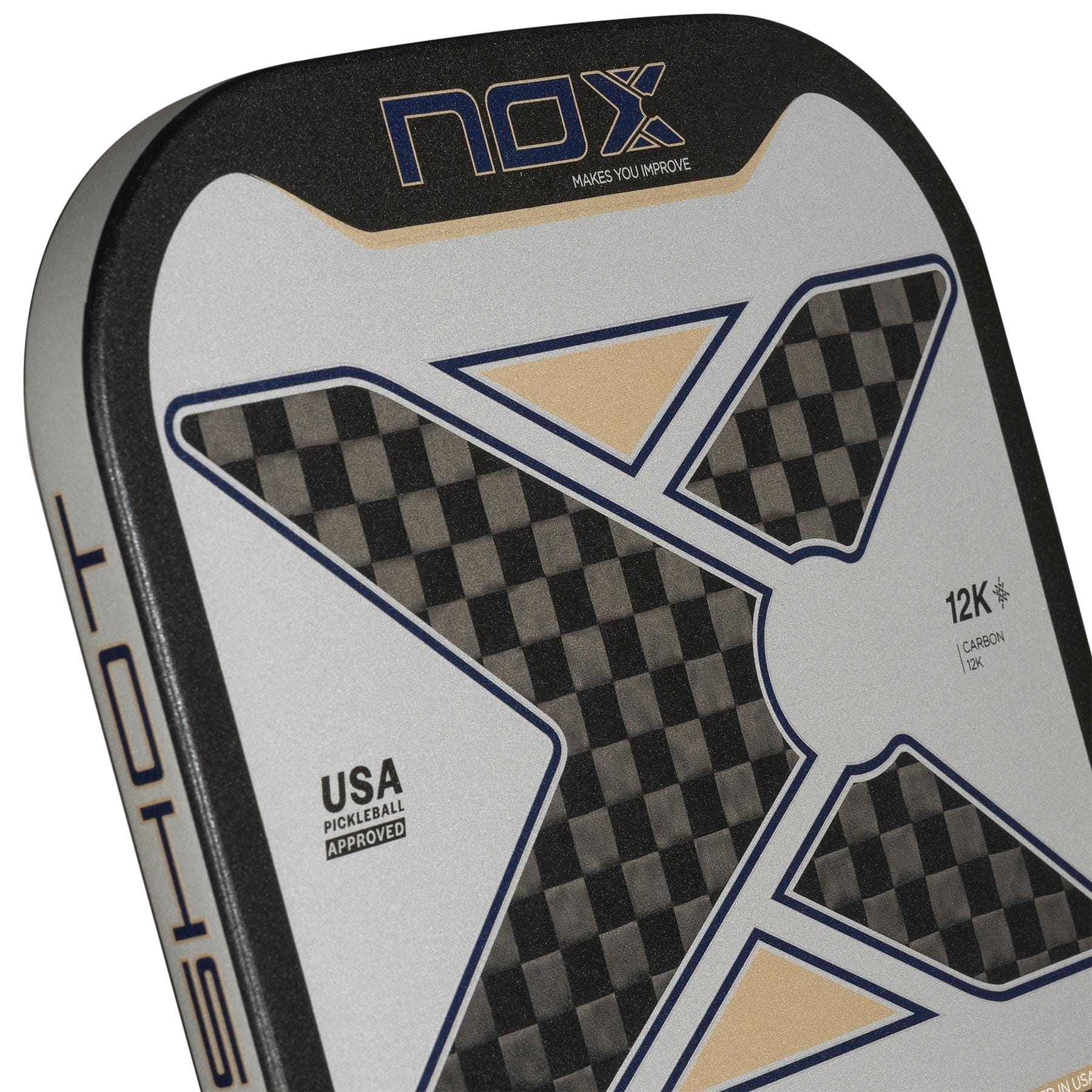 Close-up of the NOX Pro Shot Pickleball Paddle by NOX, showcasing spin technology, a large X design with black and gray checkerboard pattern, gold accents, "12K Carbon," and "USA Pickleball Approved" text.