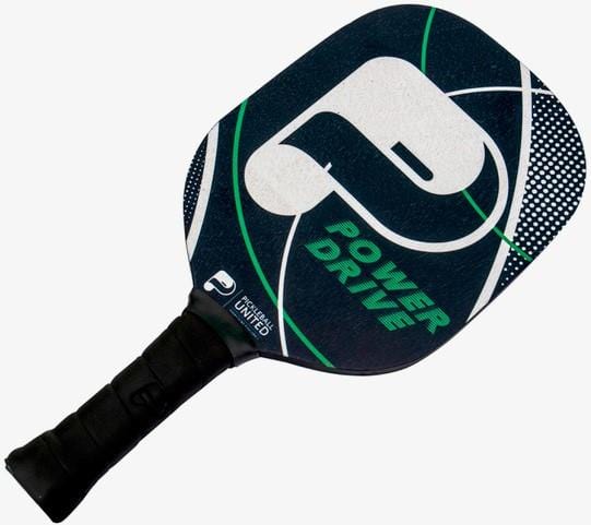 The Pickleball United Power Drive Pickleball Paddle features a black face with a large white "P" logo, green and white curved lines, a cork core for control, and a comfortable black grip handle.