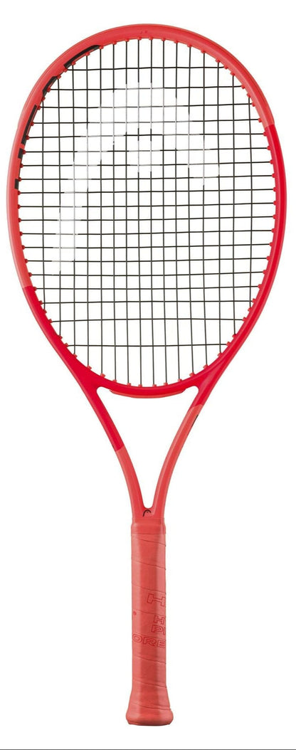 The HEAD Radical Junior 2025 Tennis Racket by HEAD, with Auxetic 2.0 technology, a red frame, black strings, and wrapped handle, is shown vertically against a white background.