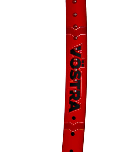 Close-up of a red tennis racket frame with the words "Volkl Vostra V8 285g" in black, outlined in white. Featuring small holes and a glossy finish, this product from Volkl delivers an exceptional Catapult Effect for enhanced performance.