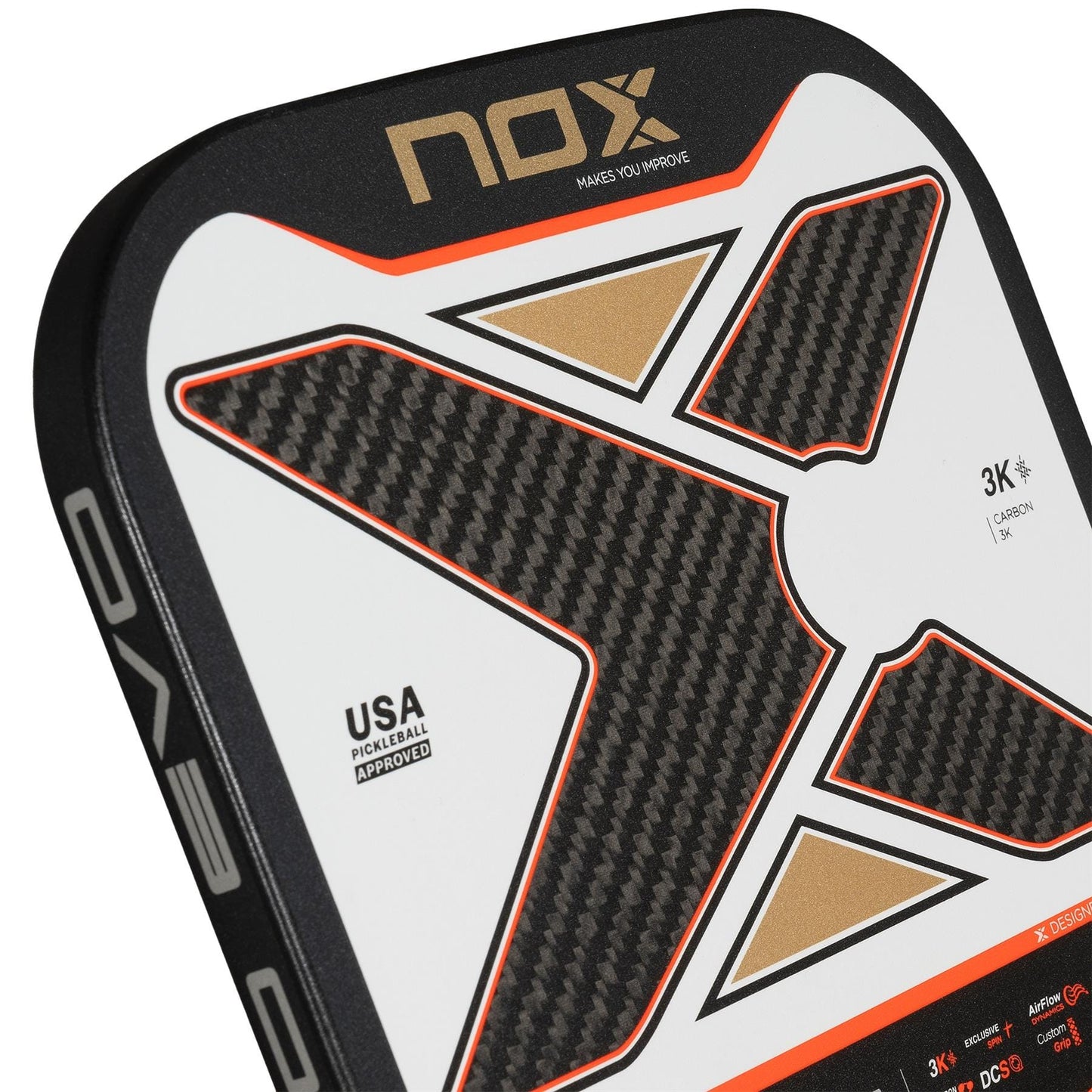 Close-up of the NOX Pro Evo Pickleball Paddle by NOX, a carbon fiber paddle with spin, showcasing a large black and gold X design, orange accents, and "USA Approved" text on a white background.