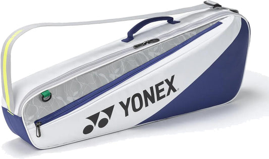 The Yonex BA52523EX Club 3 Racket Tennis Bag in white/blue features a zipper, carrying handle, shoulder strap, and Yonex branding. This lightweight bag securely holds up to 3 rackets.