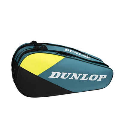 The Dunlop SX Club 6 Racket Tennis Bag in teal, black, and yellow features a white "Dunlop" logo, a sleek aerodynamic design, multiple compartments, and padded backpack straps for comfortable carrying.