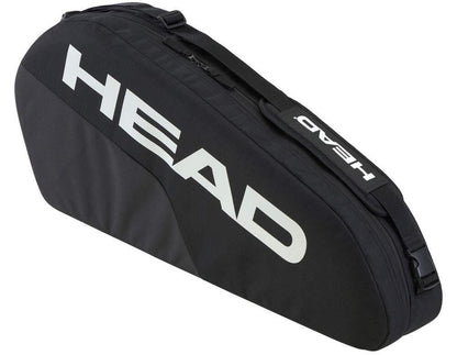 The HEAD BASE 3 Racket Tennis Bag S - BK boasts a sleek design with a large white logo on black fabric, zippered closure, and an adjustable shoulder strap for easy transport. Its reinforced construction ensures durability both on and off the court.