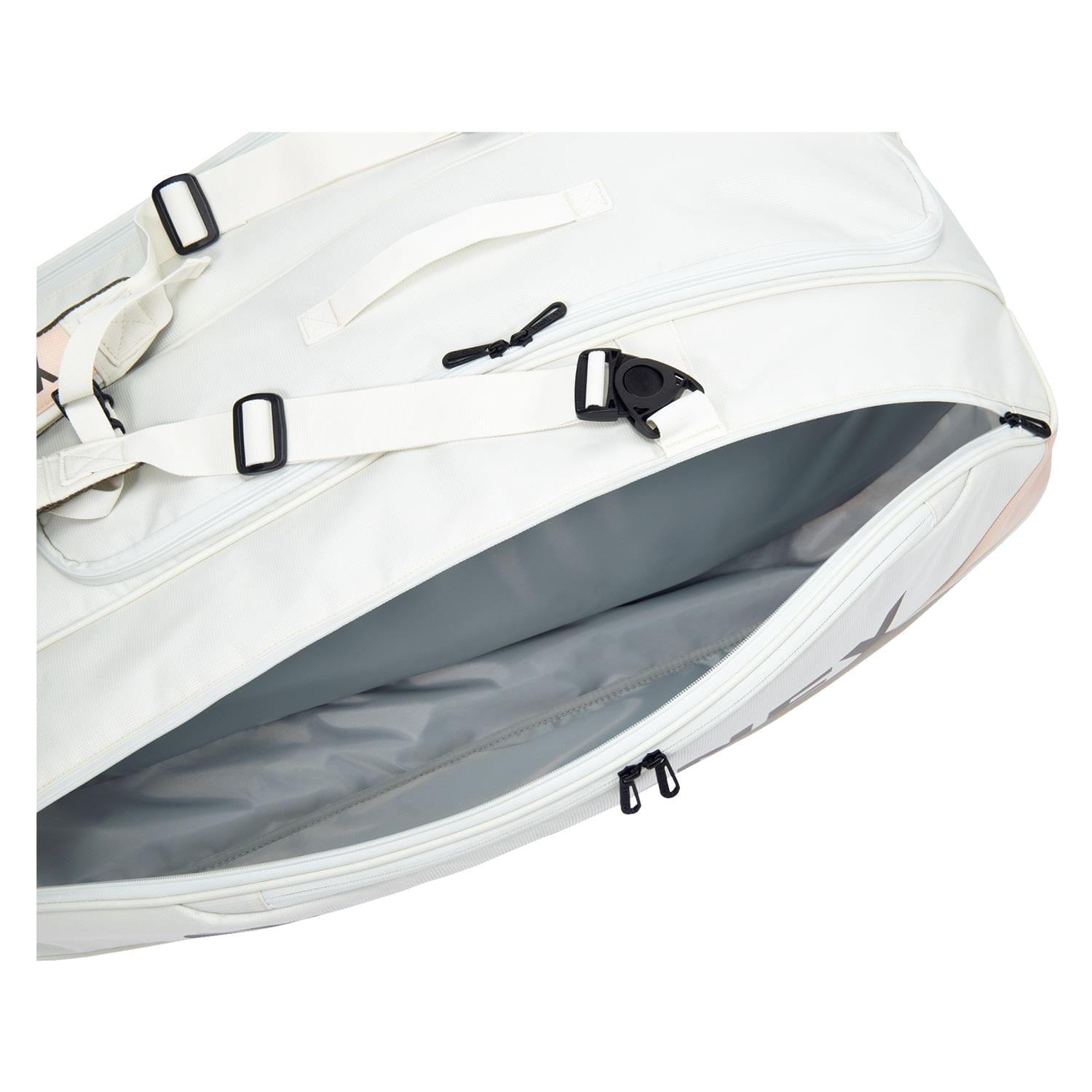 The Yonex 92429EX 9 Racket Pro Tennis Bag in Sand Beige showcases its spacious interior and specialized racket compartments through a partially open zip. The bag is equipped with black buckles and zippers, adjustable straps, and a handle on top, combining style with functionality, including Thermo Guard protection.