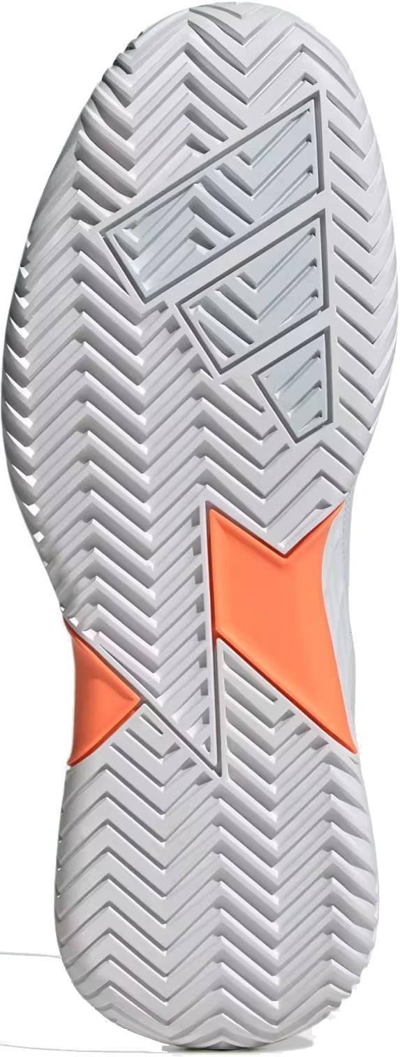 Close-up of the adidas Defiant Speed 2 Women's Tennis Shoes, featuring a white sole with herringbone tread, geometric cutouts, and a bright orange accent—ideal lightweight tennis shoes in Cloud White/Halo Blue/Beam Orange.