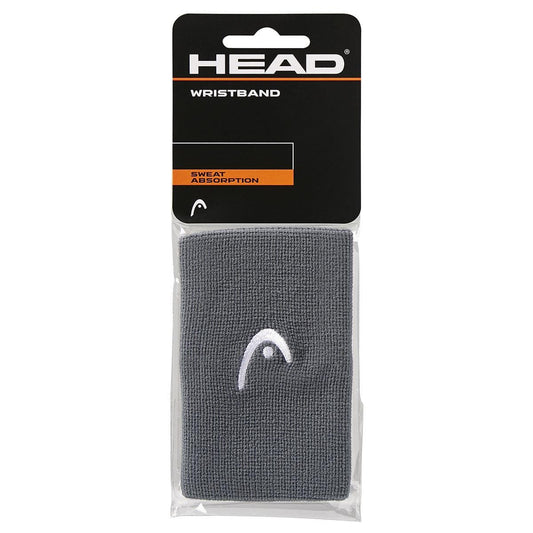 The HEAD 5" Tennis Wristband in anthracite grey, known for its sweat absorption qualities, displays a white logo and comes in packaging with a black header featuring bright orange and white text.