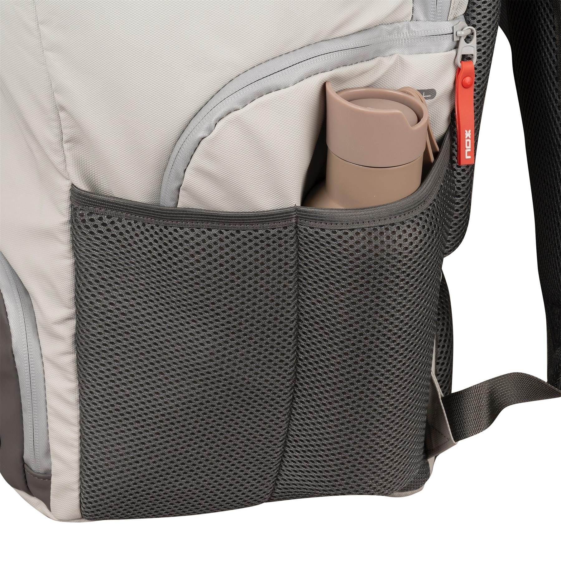 A close-up of the NOX Supra Pickleball Backpack - Cream shows its dark gray mesh side pocket holding a beige reusable water bottle. The light gray bag by NOX features ergonomic padded straps and a zipper with a red pull tab.