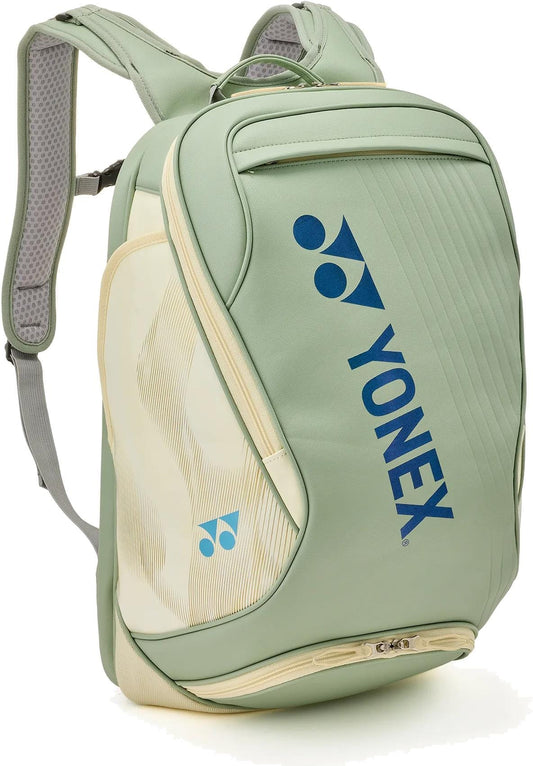 The Yonex 02612EX Expert Tennis Backpack in Smoke Green features padded shoulder straps, multiple zippered compartments, and a blue Yonex logo—combining style and function for tennis players.