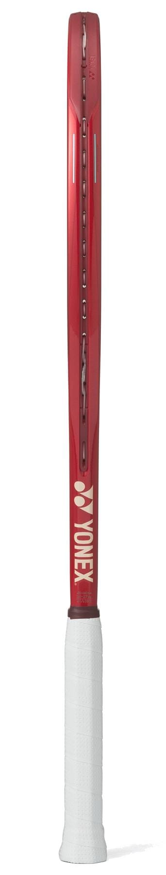 The Yonex VCORE 100D Ruby Red 2026 tennis racket is shown from the side, featuring its thin frame and spin-friendly design. The white Yonex logo and name are visible near the white grip handle at the base.