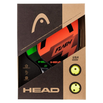 The HEAD Flash Pickleball Paddle Set by HEAD includes a bright orange and black paddle with a polymer honeycomb core and two yellow perforated balls, all visible through the retail box’s cutout windows.