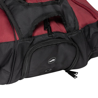 Introducing the Dunlop CX Performance 12 Tennis Racket Bag in black and red. This bag features a round logo and a textured fabric surface, enhanced with multiple visible zippers for optimal accessibility. Designed with ergonomic padded shoulder straps and handles, it ensures easy portability. Additionally, it includes a ventilated shoe compartment for extra convenience.